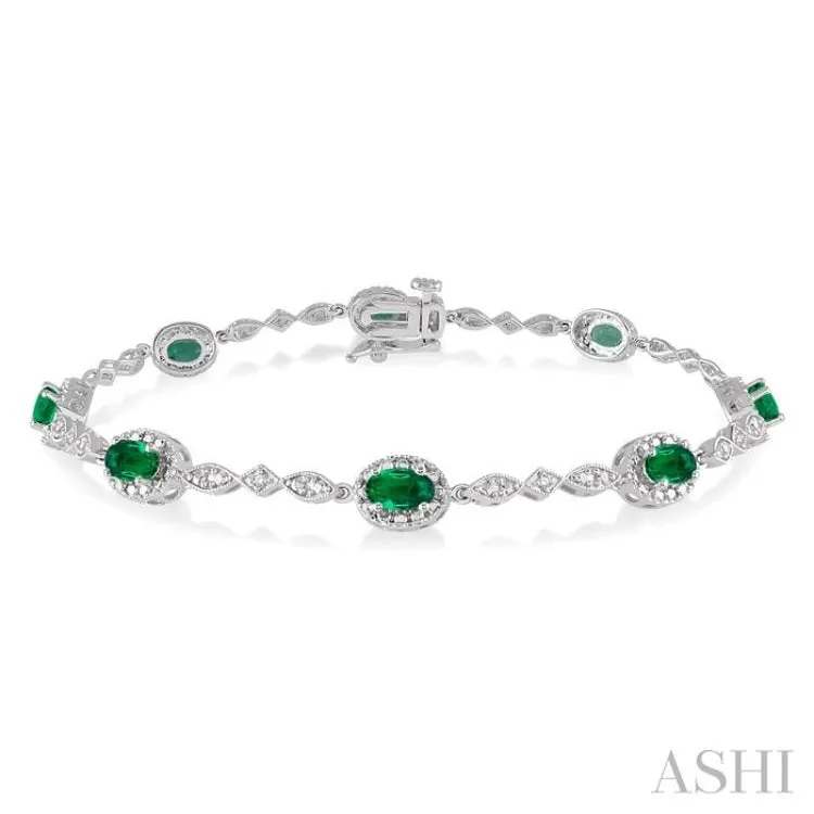 5x3MM Oval Cut Emerald and 1/20 Ctw Single Cut Diamond Bracelet in 10K White Gold