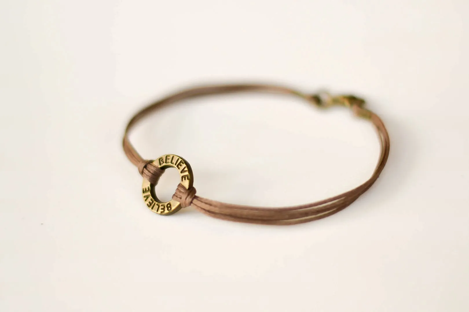 Bronze circle Believe bracelet for men, brown cord, Karma bracelet, fathers gift for him